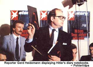 Reporter Gerd Heidemann displaying Hitler's diary notebooks.